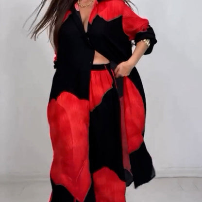 Elegantes und sinnliches Set aus langem Blusen-Shirt mit Druck und weiter Hose